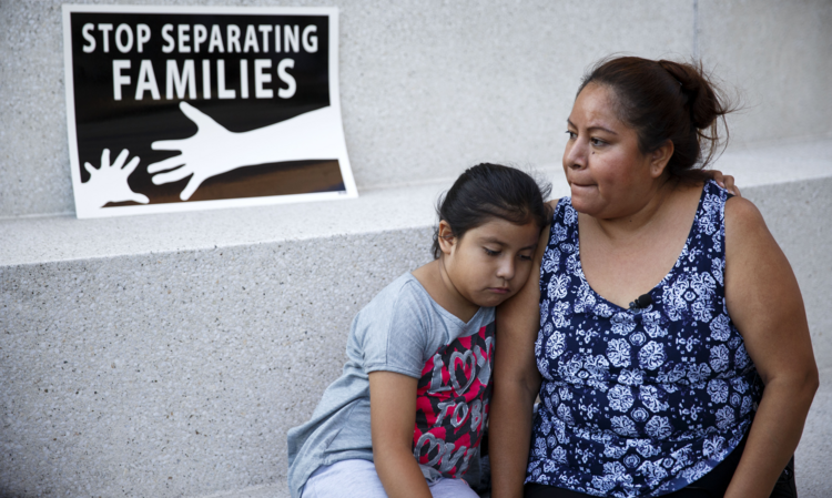 A mother and daughter in Los Angeles react after the U.S. Supreme Court issued a split ruling June 23 blocking President Barack Obama's executive actions to temporarily stop deportations. (CNS photo/Eugene Garcia, EPA) 
