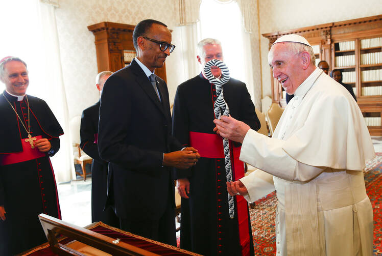 Pope Francis, right, and Rwanda's President Paul Kagame exchange gifts during a private audience at the Vatican, on March 20, 2017. (Tony Gentile/Pool photo via AP)