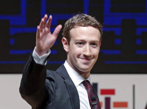 Mark Zuckerberg, chairman and CEO of Facebook, waves at the CEO summit during the annual Asia Pacific Economic Cooperation (APEC) forum in Lima, Peru.